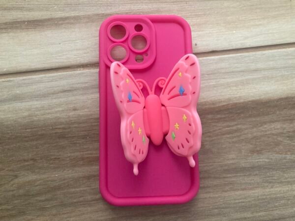 Cute Pink iPhone case for iPhone 13 Pro on wood-like tiles flooring upclose