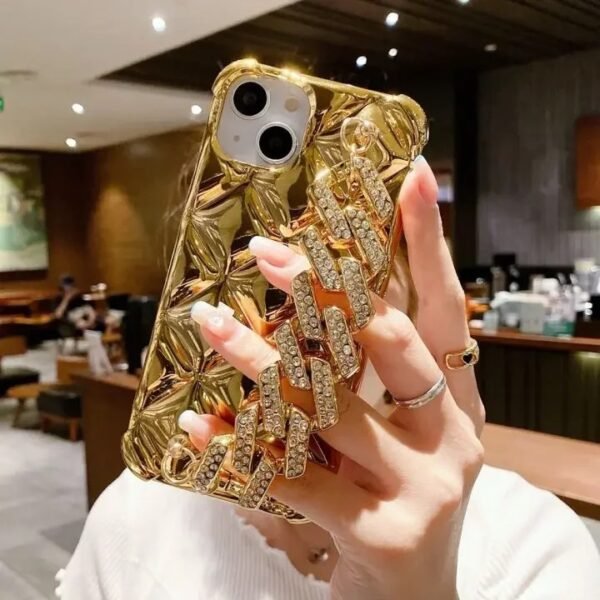 Luxury Electroplate TPU iPhone Case With Diamond Chain Being Held by a lady